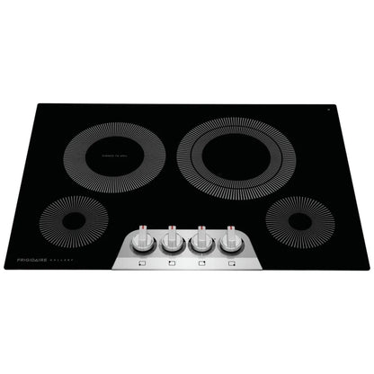 Frigidaire Gallery electric cooktop in use, showcasing powerful heating elements with a pot simmering on the burner.