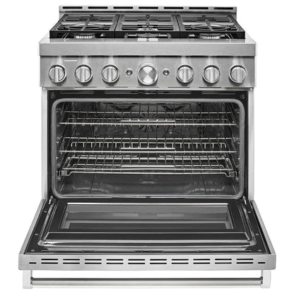 Spacious oven interior with three racks, halogen oven lights, and black interior color for optimal cooking visibility. The oven features a hidden bake element for an even cook.