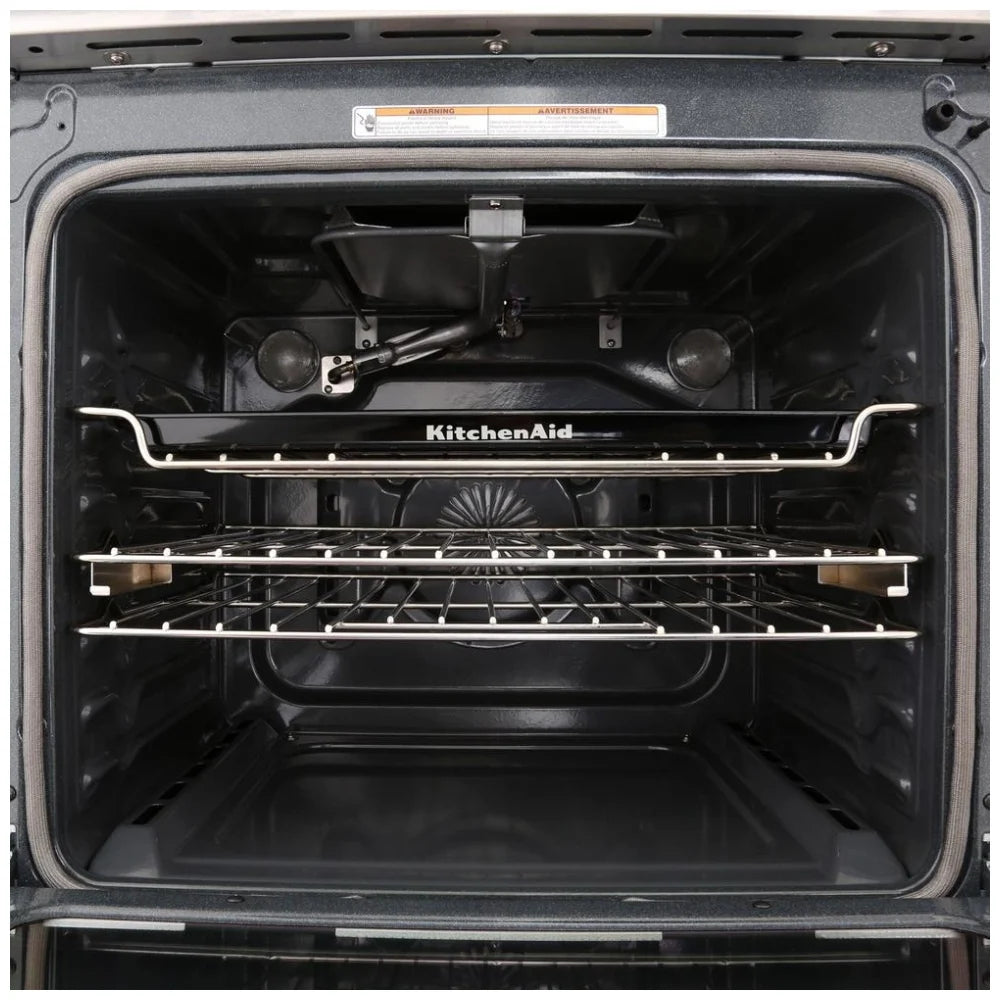 Close-up view of the KitchenAid KSGG700EBS gas slide-in range interior, showcasing the spacious oven with multiple racks and AquaLift® steam clean system