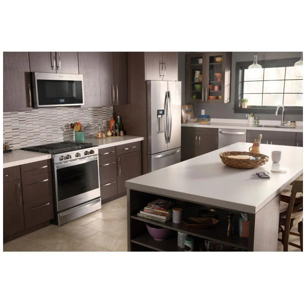 Side profile of the gas slide-in range in a modern kitchen setting, showcasing its sleek black cooktop and stainless steel accents