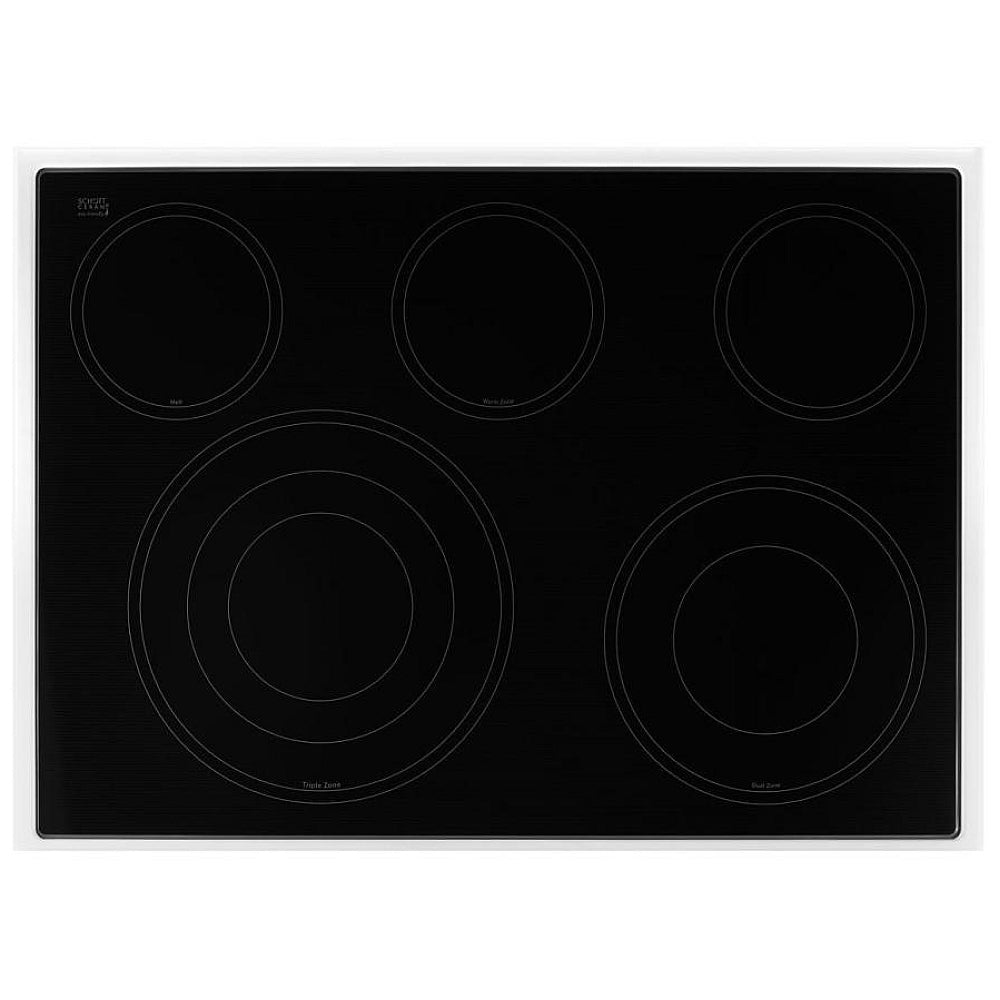 Close-up view of the radiant ceramic glass cooktop with five burners, including a triple and melt burner.
