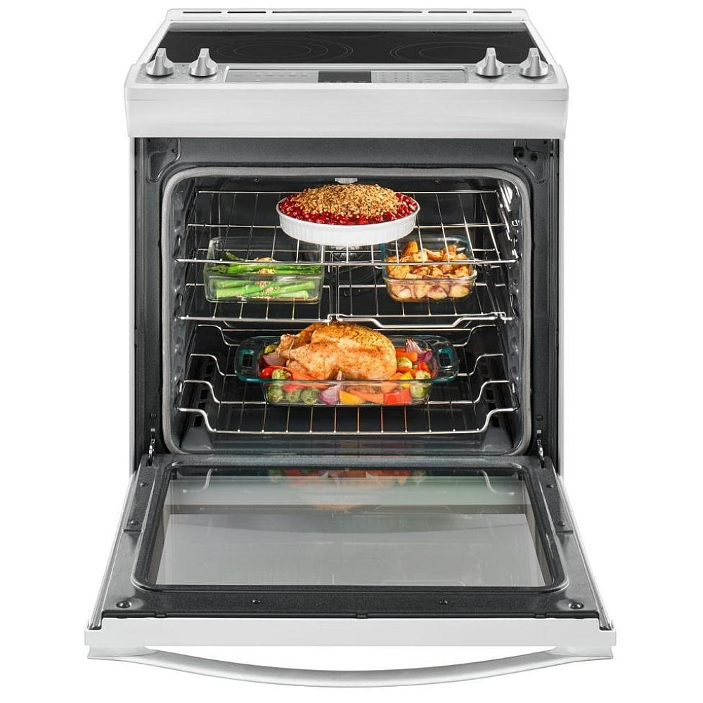 Whirlpool 30-inch slide-in electric range with food cooking in the oven, highlighting the even heat distribution and convection system for consistent results.